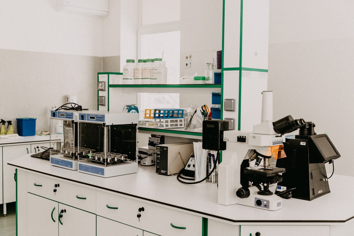 Biomedical laboratory workbench with microscope and research equipment
